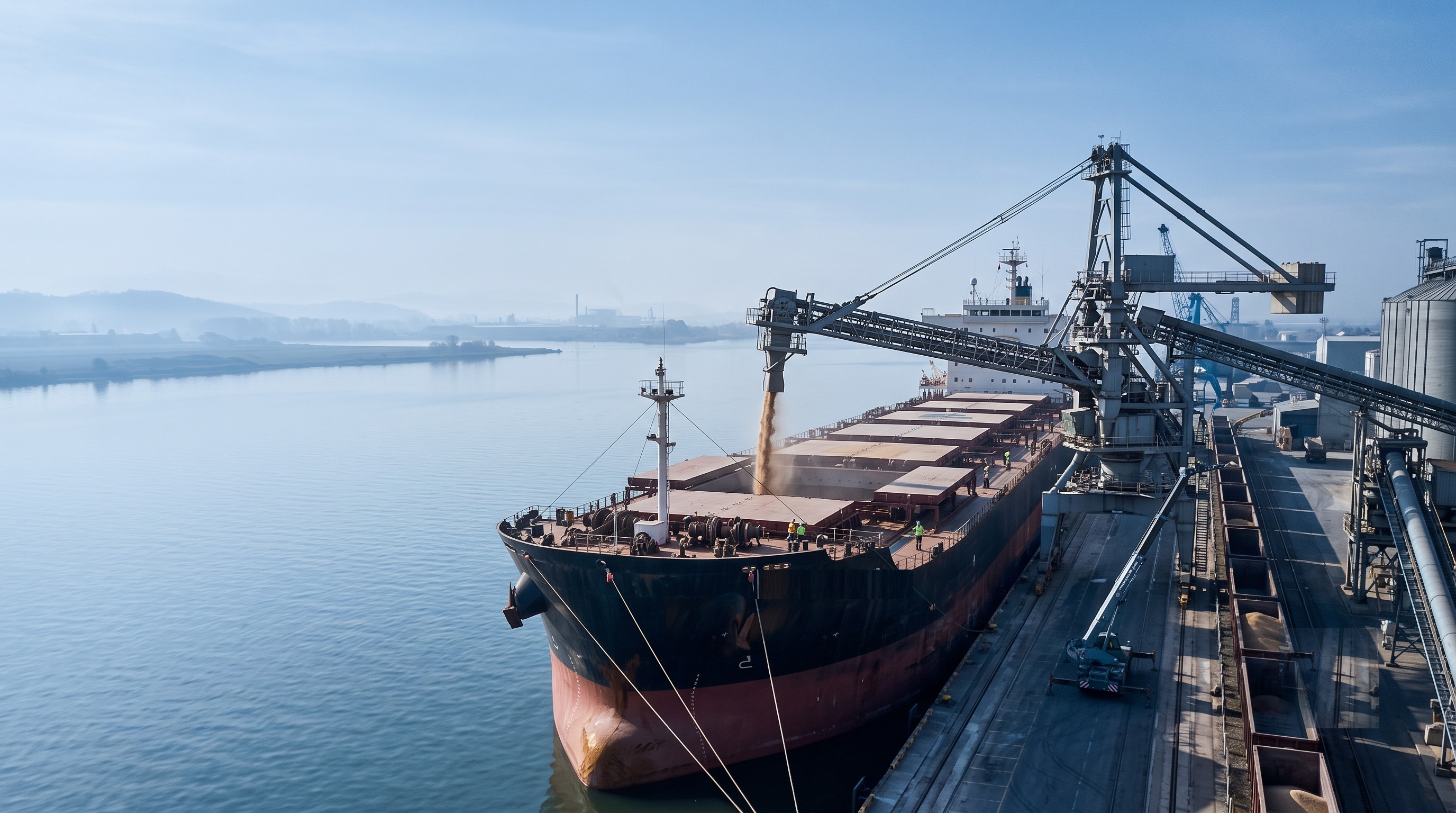 Bulk carrier vessel loading commodities at port